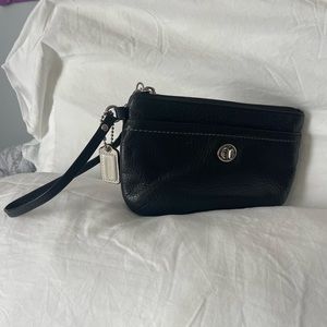Medium size black Coach wristlet with white hang tag